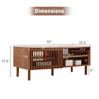 Table basse avec portes coulissantes cannelées, rangement double face et pieds en bois, 110 cm de large
